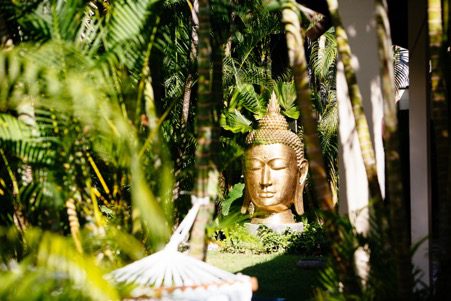 Embracing nature Bali retreat buddha statue