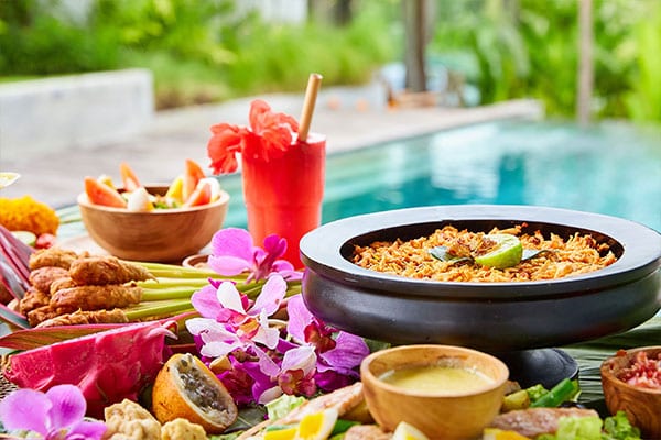 Delicious healthy food by the pool at Bliss Bali retreat