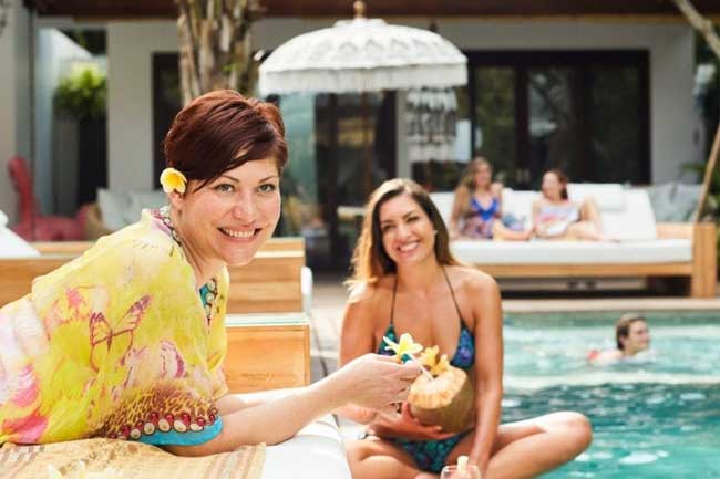 Guests by the pool at Bliss Bali retreat