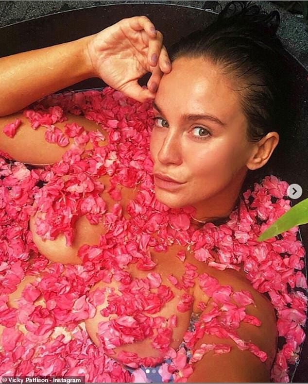 Wow! The reality star also posed topless for a trio of shots of her taken while bathing in a bath of pink rose petals