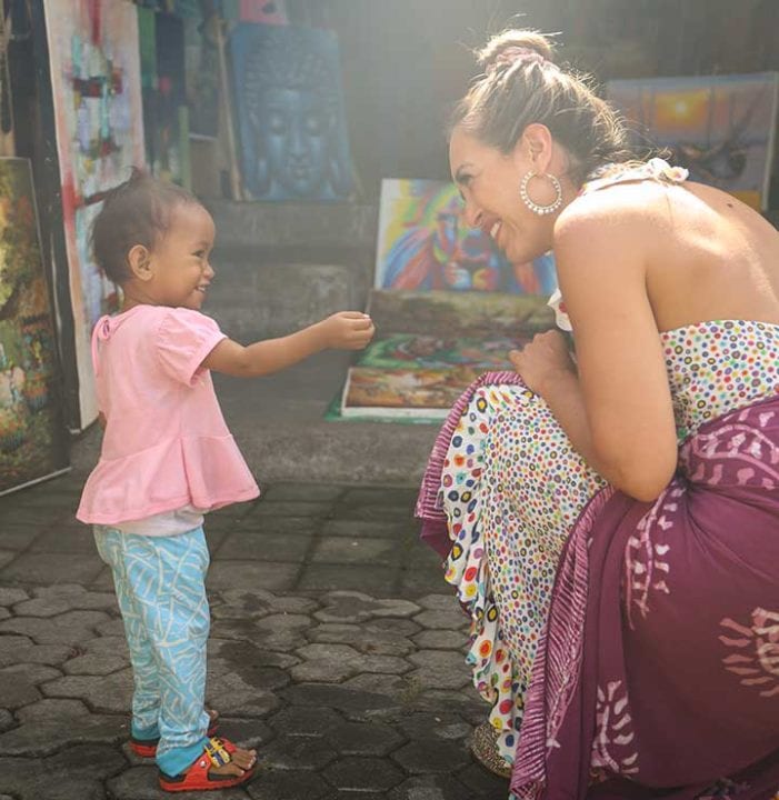 Bliss Bali retreat guest with Balinese child